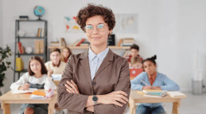 principal standing in front of a classroom full of students