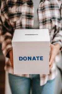 woman holding a donate box